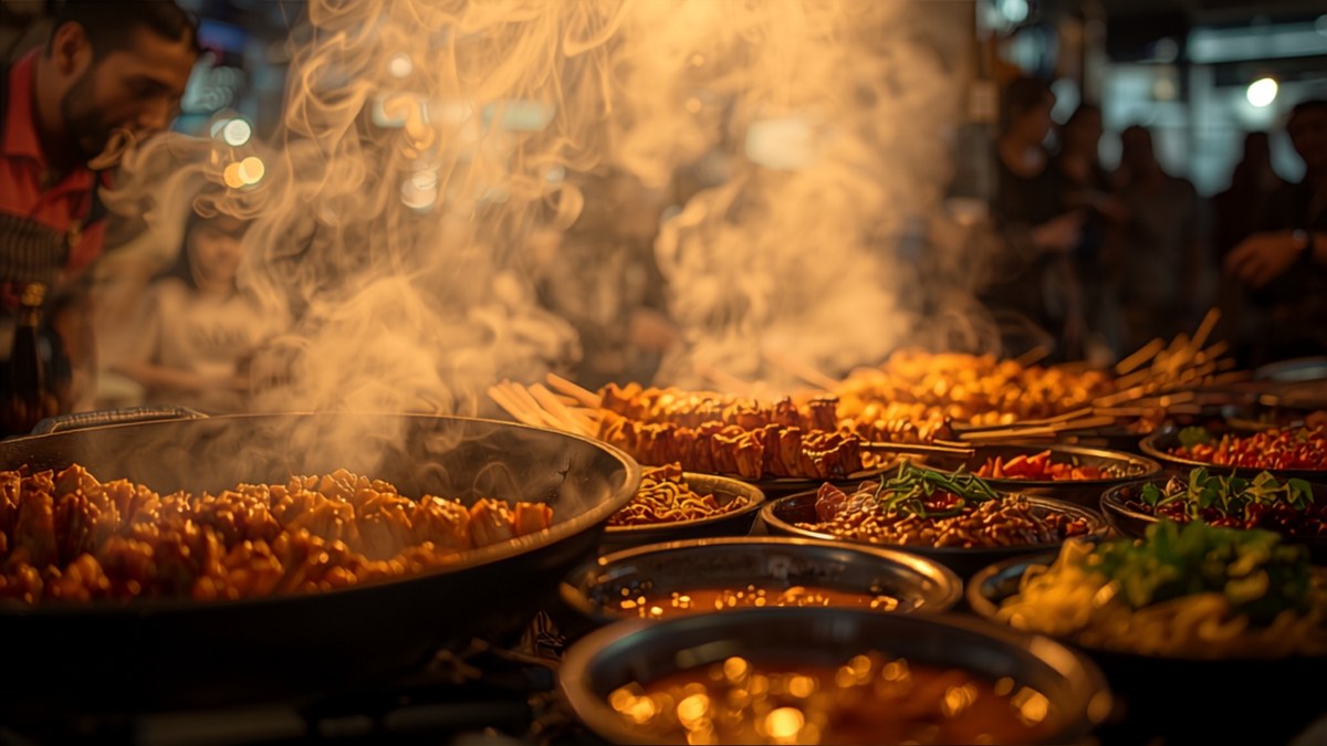 A Bangkok street-food stall with Thai dishes laid out